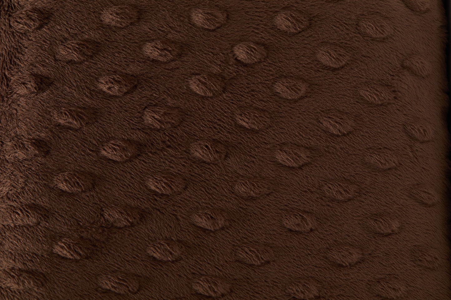 Close-up of a brown textured fabric surface