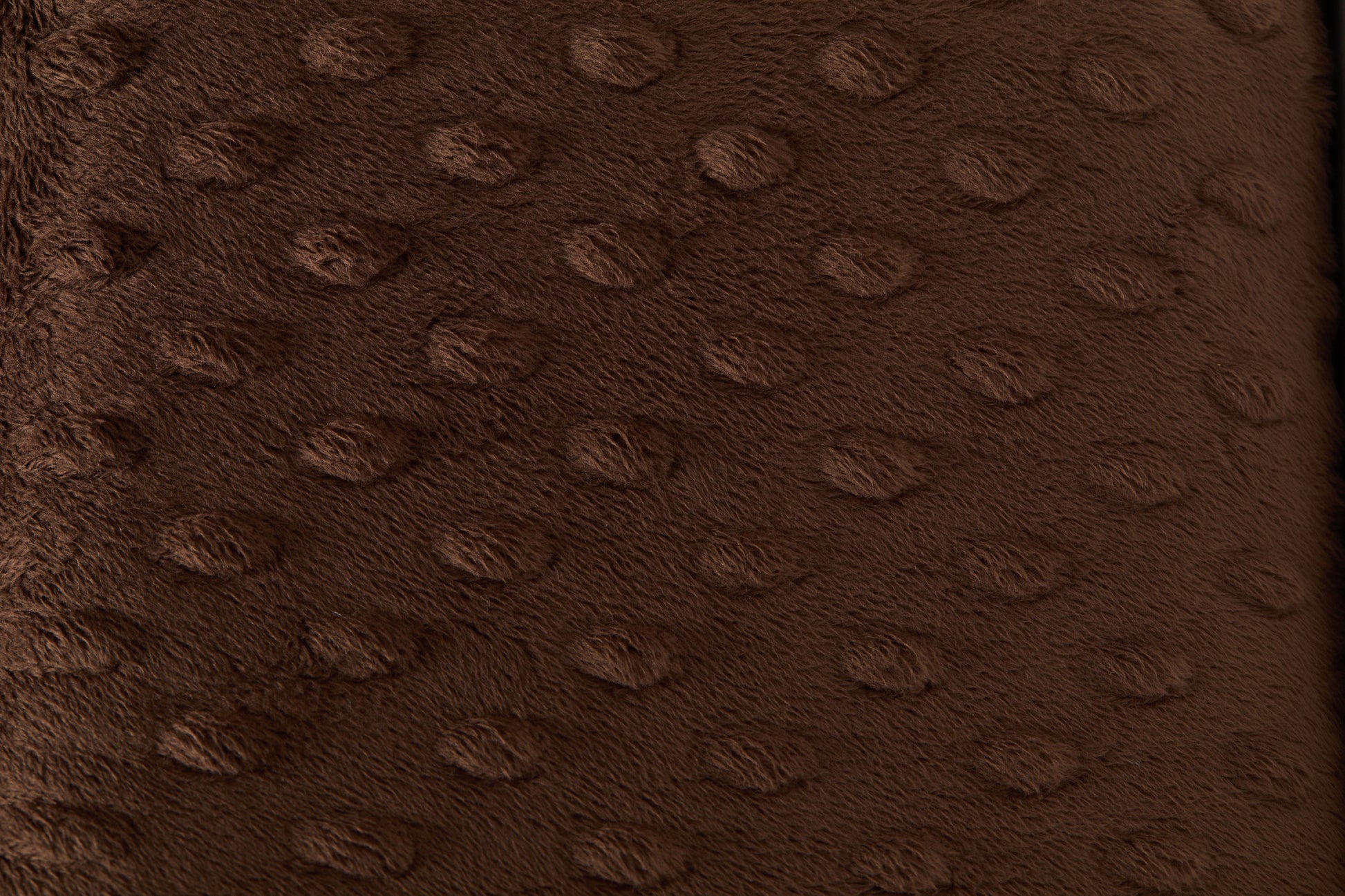 Close-up of a brown textured fabric surface